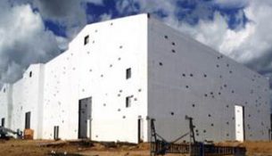 A white building being built.